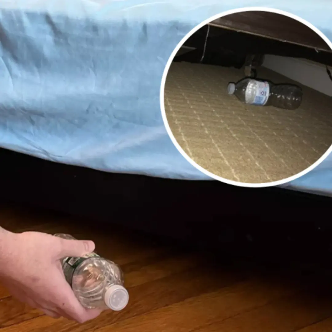 Why do you have to throw your water bottle under the bed when staying in a motel or hotel?